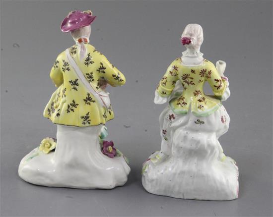 A near pair of early Derby Pale Family figures of a seated gentleman and woman, c. 1756-8, h. 13cm, slight restoration